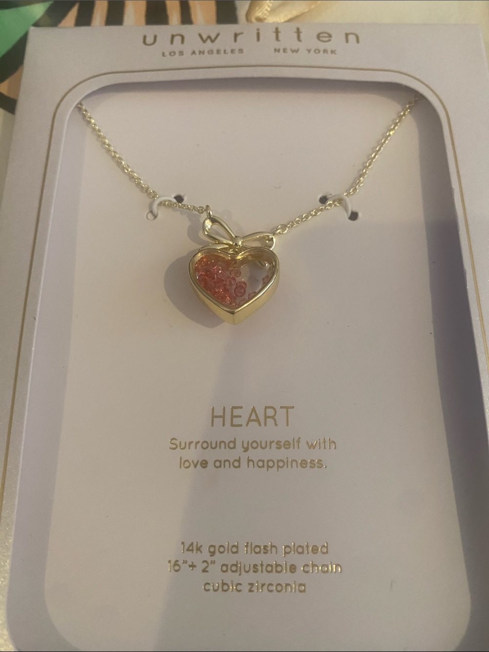 Unwritten Gold Heart Necklace with Pink Accents and Bow Detail